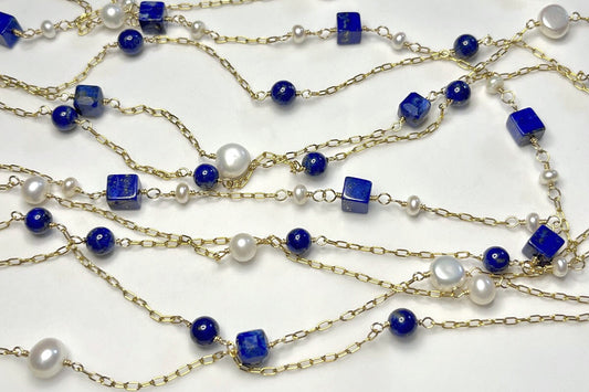 Mix of 14K gold-filled necklaces in deep blue lapis and freshwater pearls from Modern Whimsy Jewelry