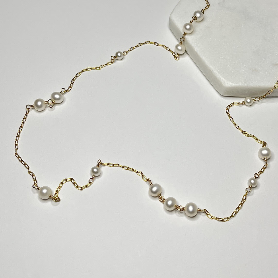 Elegant 14K Gold fill station necklace with asymmetrical pattern of freshwater pearls