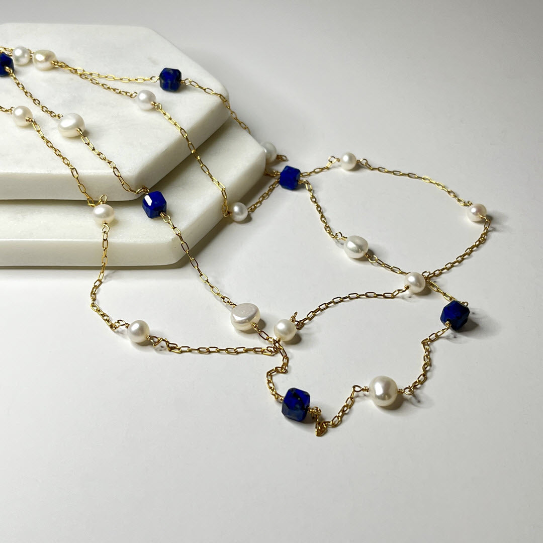 Two 14K gold-filled station necklaces with pearls and lapis cubes