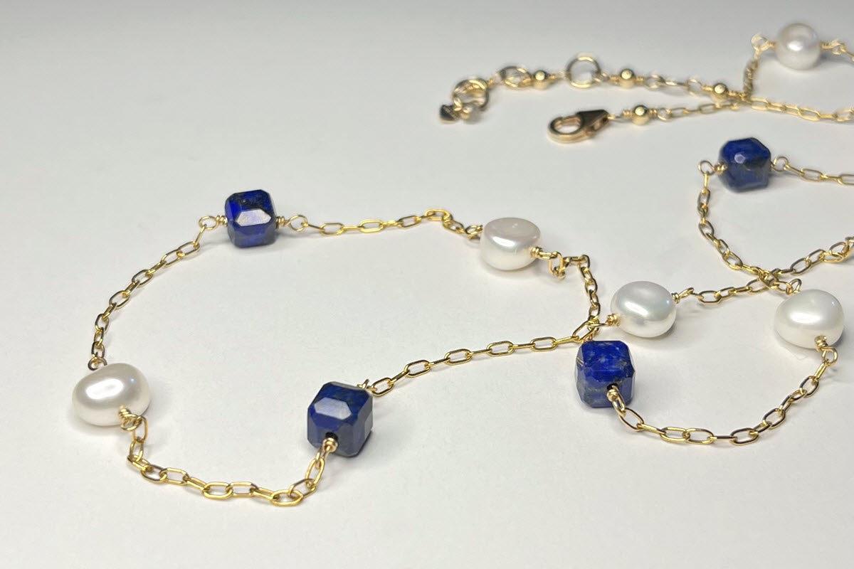 Station necklace with pearls and blue lapis gemstone cubes in 14K gold-filled chain