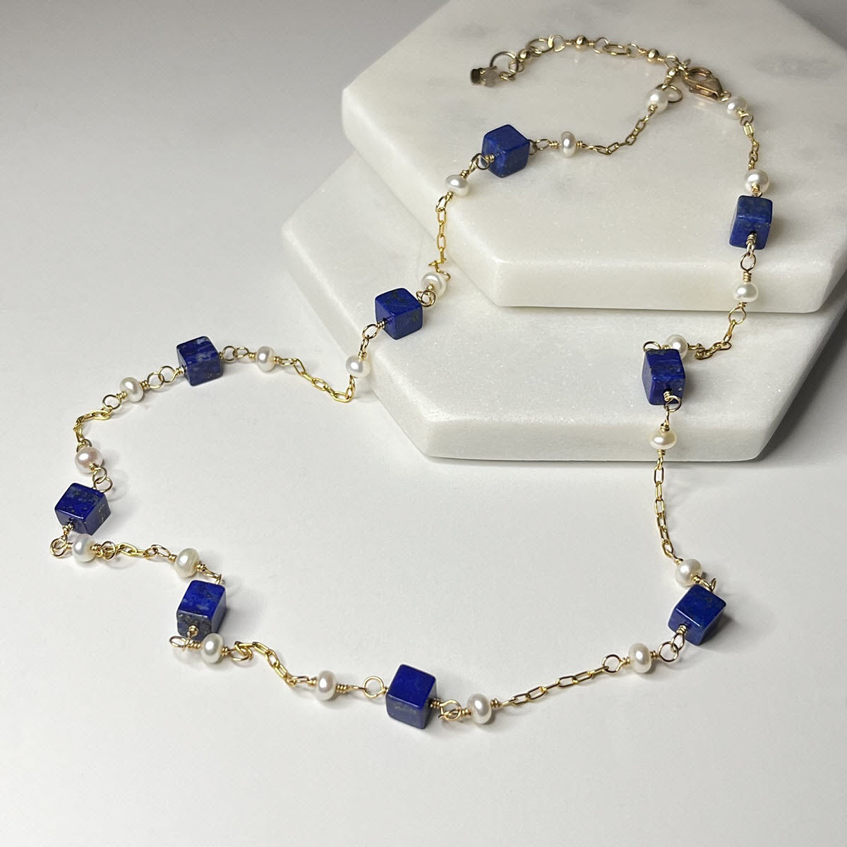 Station necklace with tiny pearls and blue lapis gemstone cubes in 14K gold-filled chain